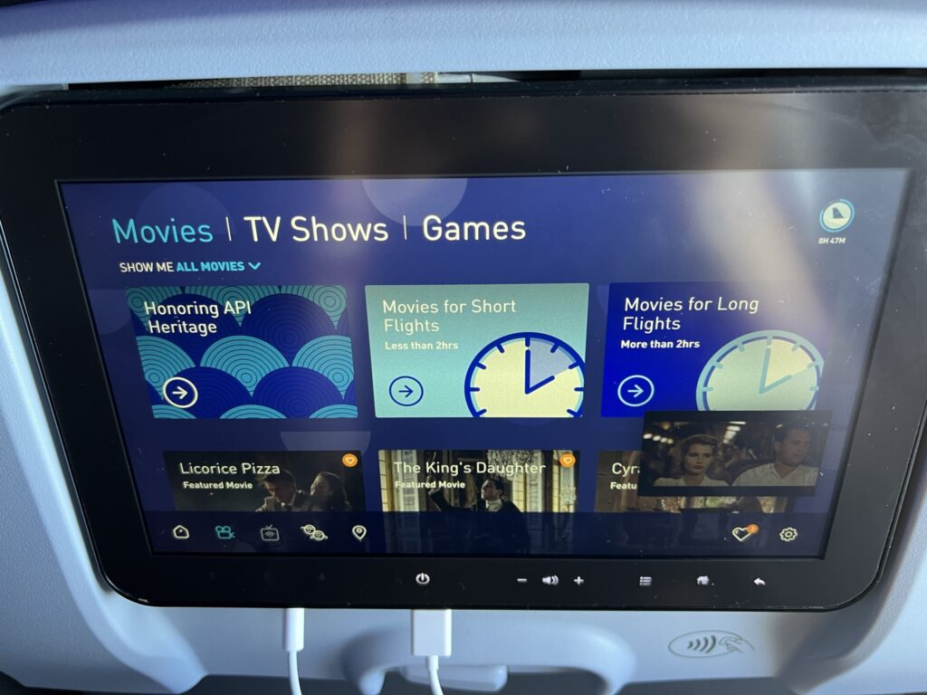 A close up of JetBlue's embedded IFE. The screen is on the entertainment landing page. Movies, TV shows and games are listed.