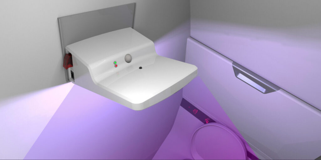 Diehl Aviation's Portable Clean Light in action, with UVC light bathing the lavatory in sanitizing ultraviolet light