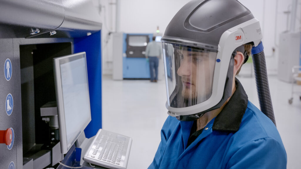 A man is working on in Collins Aerospace's new facility in Monroe