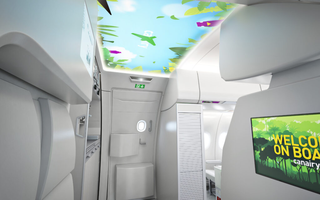 An image of sea life is being projected onto the aircraft ceiling