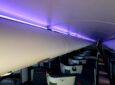 STG Aerospace mood lighting, in this instance showing purple, stretches down the length of the business class cabin