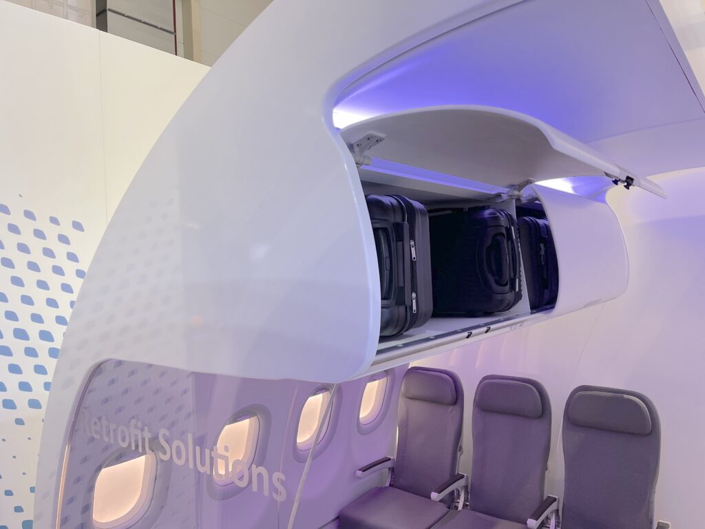 L-bin by Airbus is being displayed as the new retrofit overhead bin option on teh AIX show floor of 2022