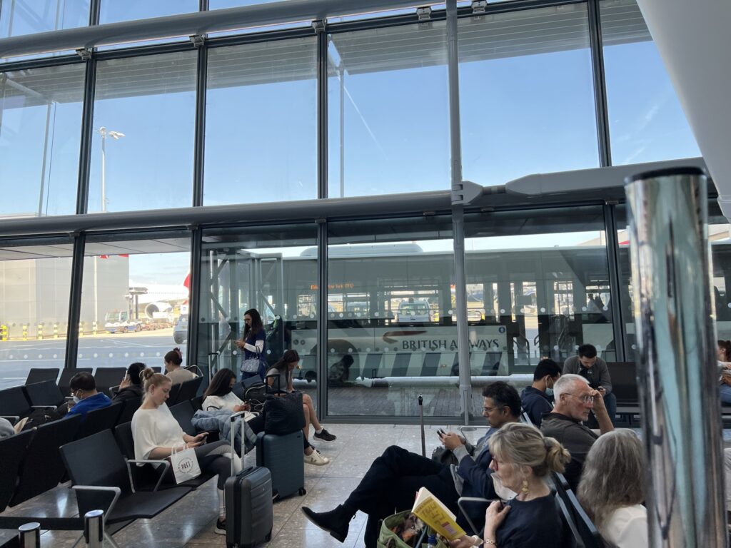 Passengers are waiting at the gate for boarding of the bus to start with British Airways