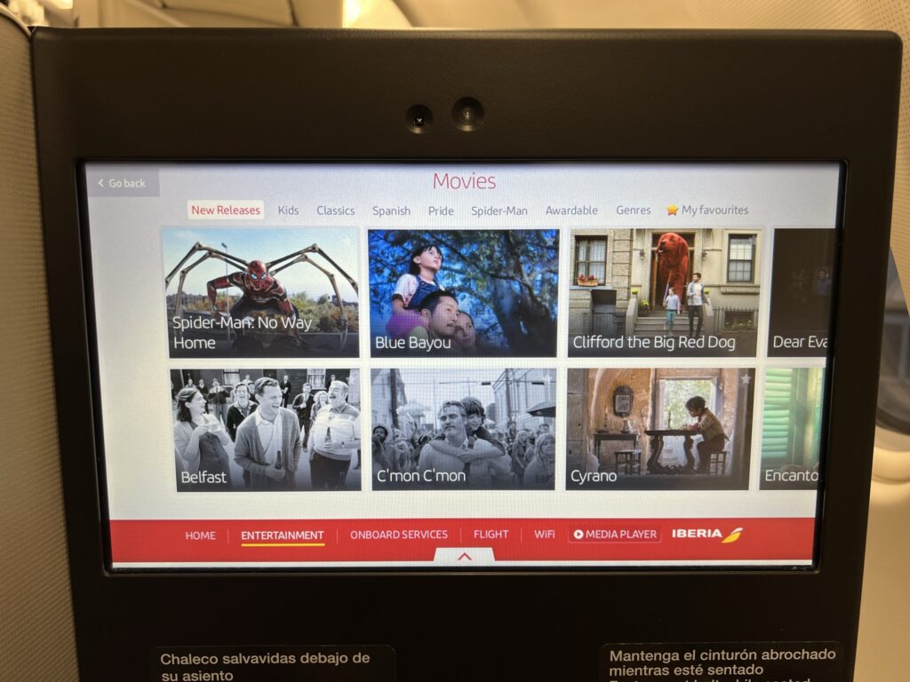 An IFE screen showcasing the movie selection on this Iberia A330