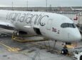 A Virgin Atlantic A350-1000 parked at the gate for boarding.