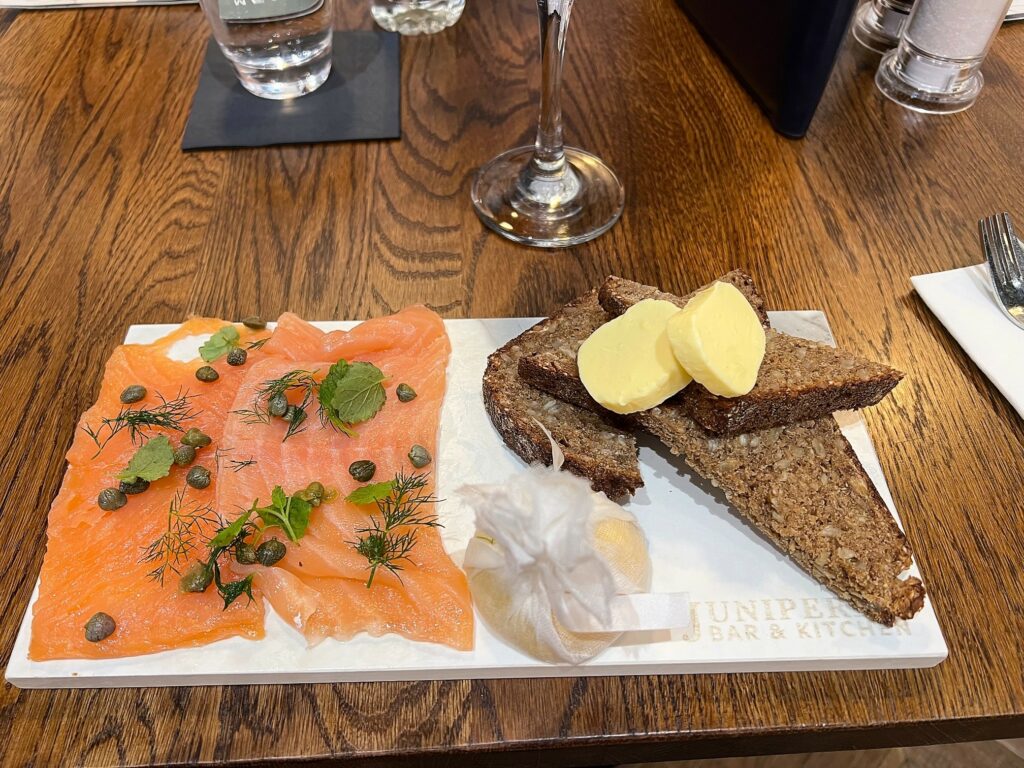 A plate with bread, cheese and salmon from the Juniper & Co. Restaurant in Gatwick Airport