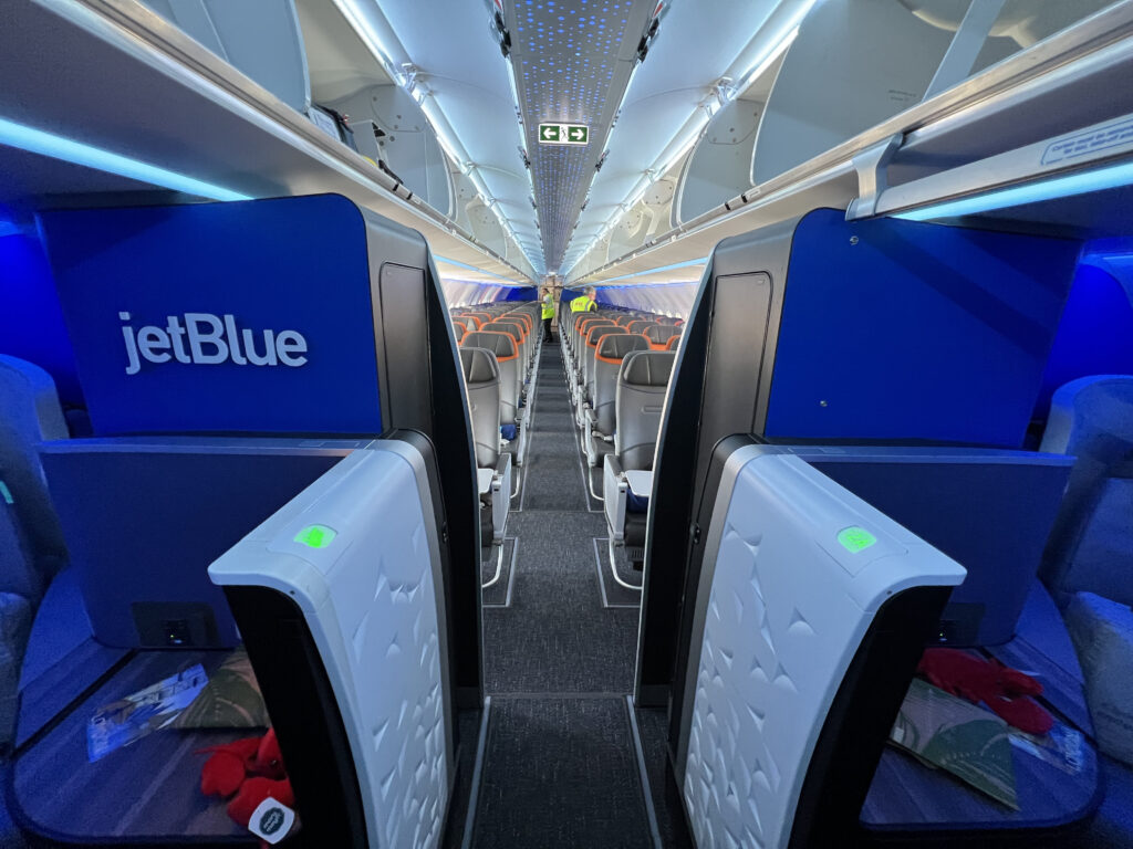 Inside the JetBlue A321LR aircraft. This image shows where the Mint cabin ends and the core economy cabin begins.