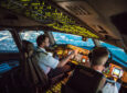Two pilots at work during departure of Dallas Fort Worth Airport in United States of America. The view from the flight deck.