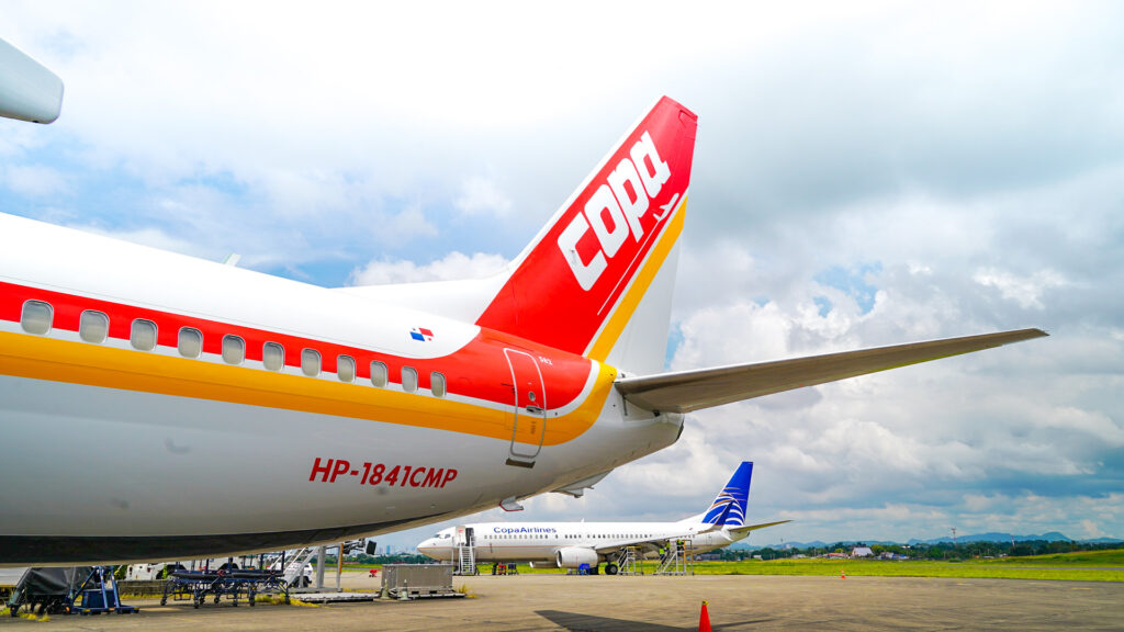 Copa Airlines 75 Anniversary livery is a red and yellow stripe wrapping around the aircraft from nose to tail.