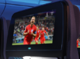 An IFE screen with the FIFA World Cup Playing on it. qatar