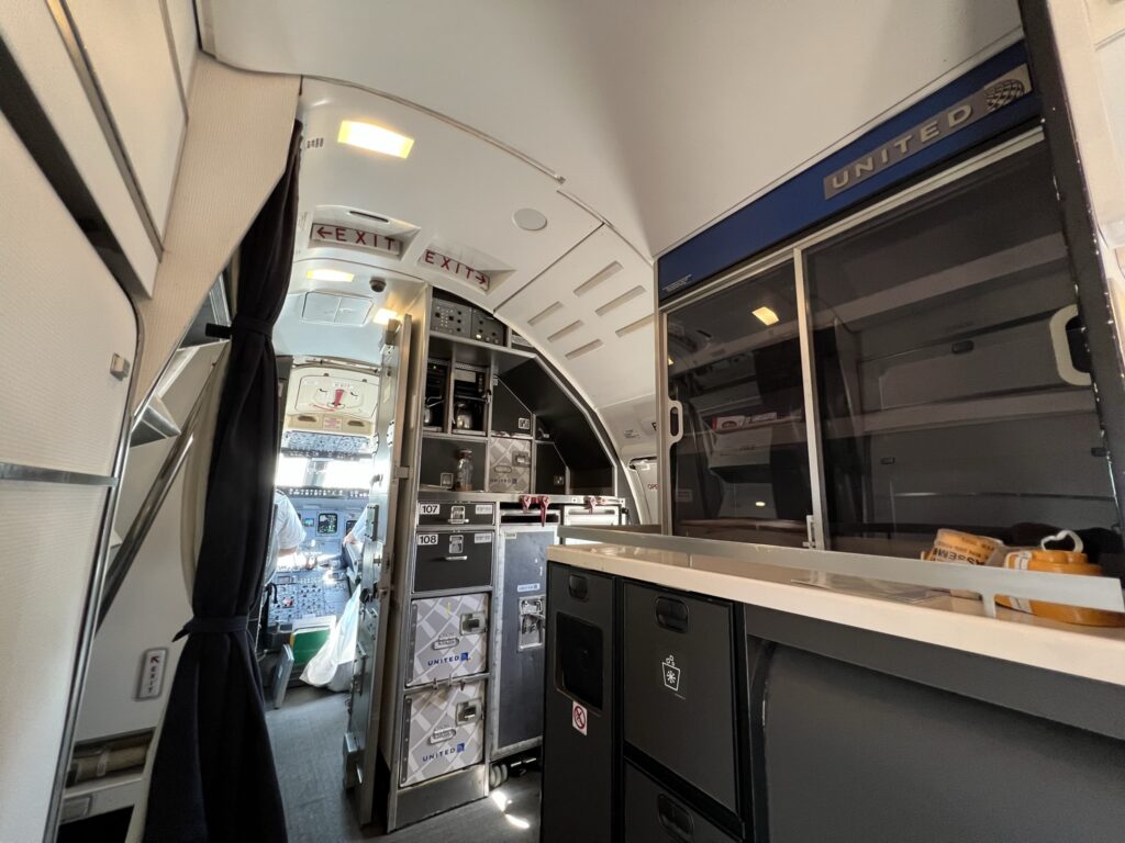 Galley and walk-up snack bar at the front of the United CRJ550