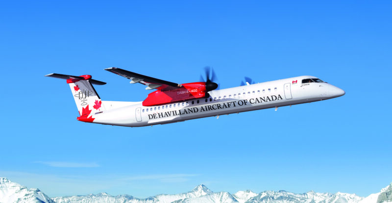 De Havilland dash 8-400 inflight over the snowy mountains.