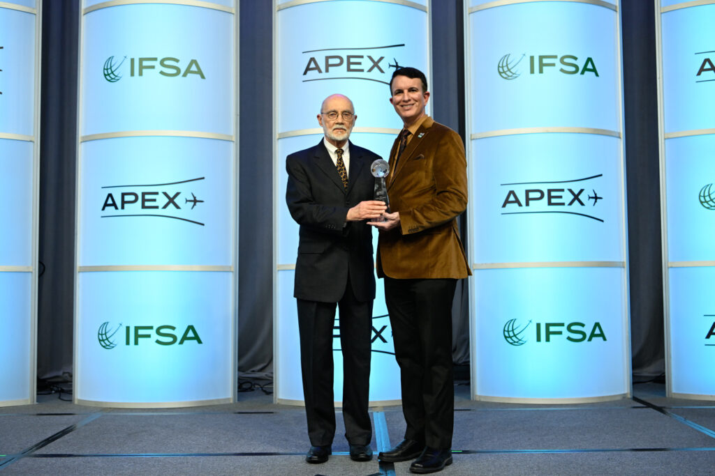 Joe Leader hands the APEX Lifetime Achievement Award to Michael Childers