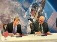 Two executives are signing an agreement regarding Azerbaijan selects Aireon data for air traffic services