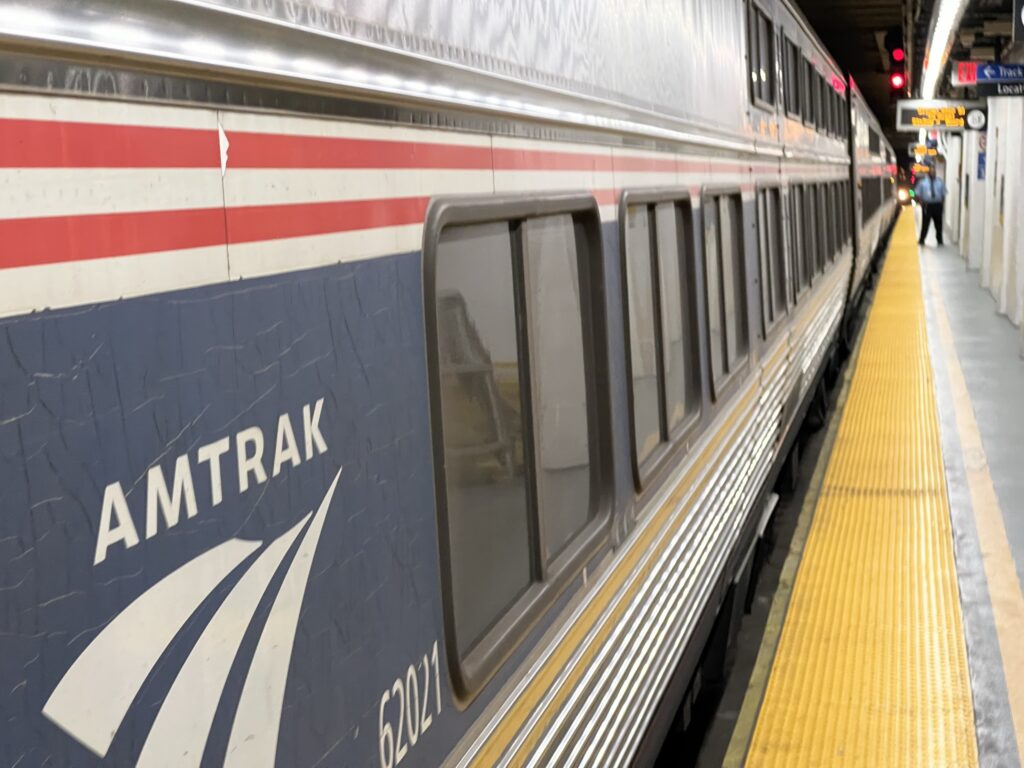 Amtrack train arriving at the boarding platform in New York