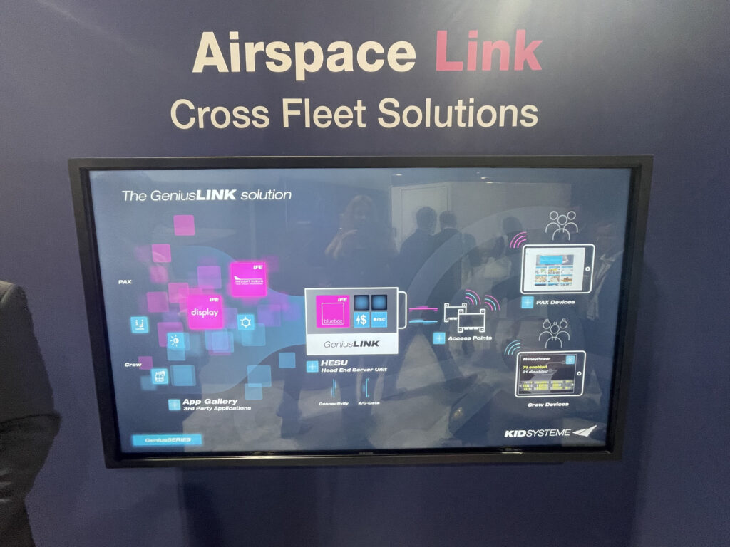 Airspace Link display at APEX/IFSA EXPO 2022 in Long Beach. A large monitor is displaying an image of the GeniusLINK solution. 