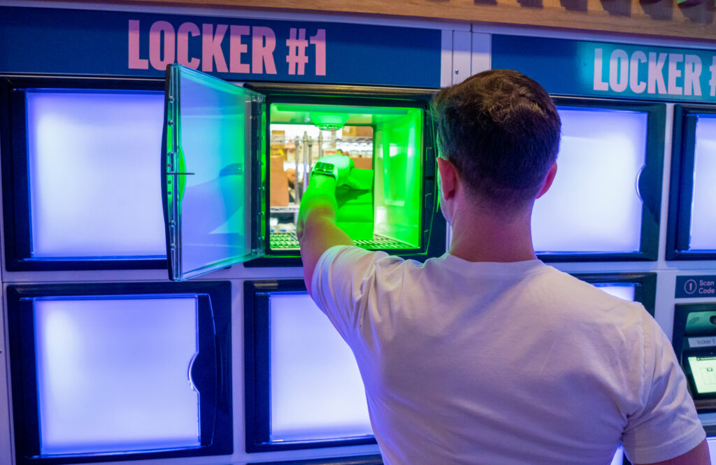 A man removes a meal from the RDU ghost kitchen locker