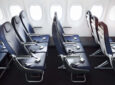 Acro Aircraft Seating Series 9 slimline economy class seats in an aircraft cabin. The seats are navy blue and in a 3-3 configuration.