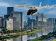 A rendering of Eve’s electric vertical takeoff and landing (eVTOL) aircraft over a city.