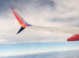 A Southwest Airlines 737 in-flight. The wingtip of the aircraft is seen in this photo.