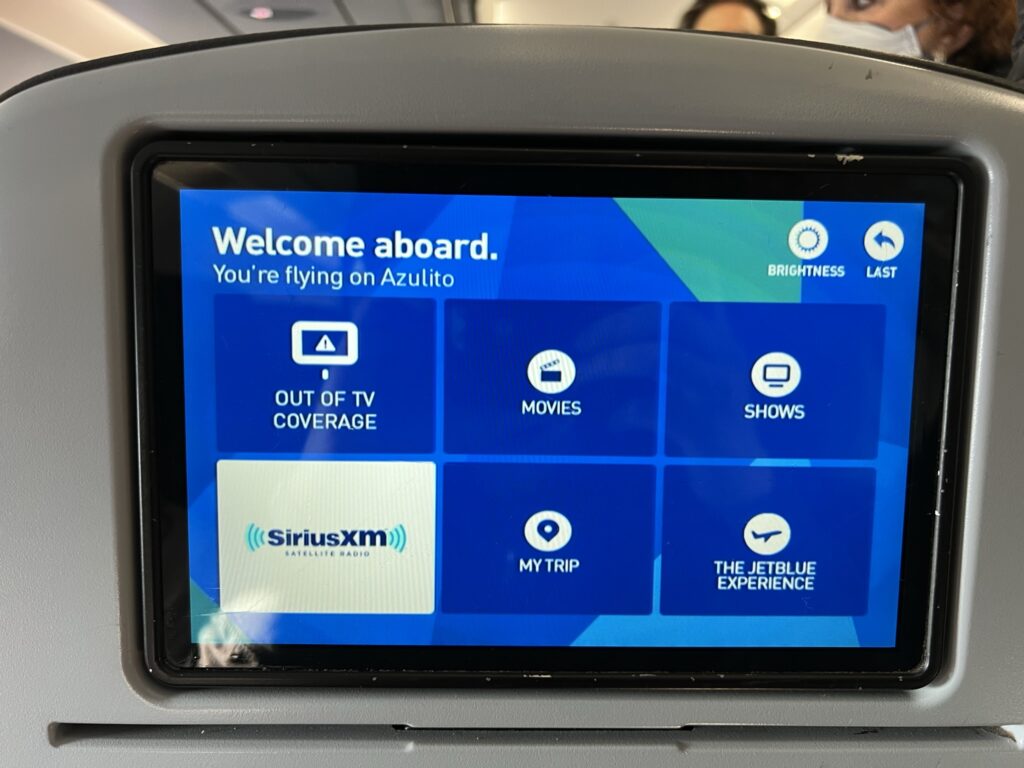 JetBlue IFE screen embedded into the seatback of an economy class seat.