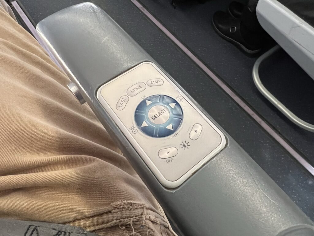 IFE controller on the armrest of the JetBlue seat