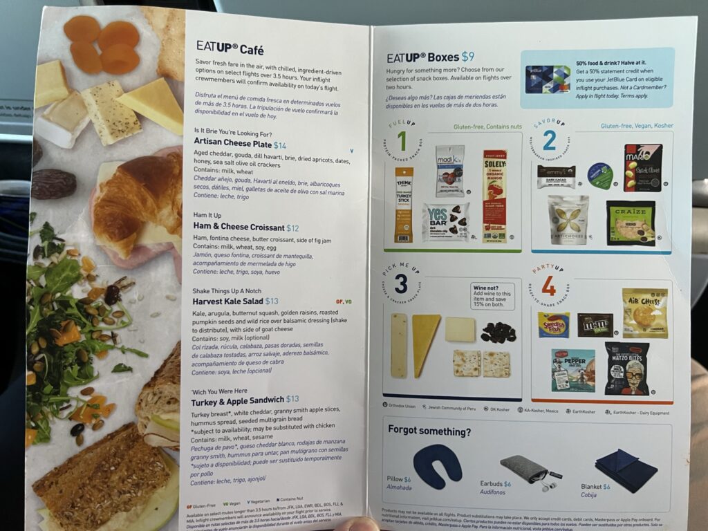 JetBlue's inflight menu, with a raft of choices on offer including sandwiches, snack boxes, individual snacks and a salad.