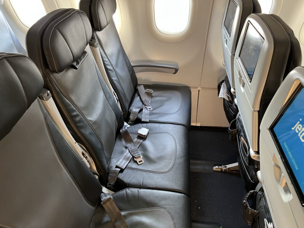 Seat triple onboard the JetBlue A321ceo, showing ample legroom