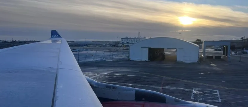 SAS A330 in Arlanda, Sweden. A wingtip is seen as the sun sets