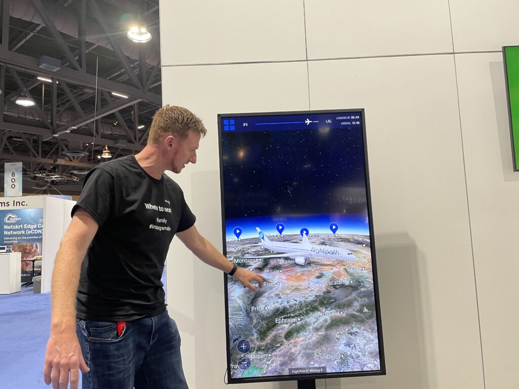 FlightPath3D CEO Duncan Jackson demonstrating the moving map on a large display monitor during the APEX EXPO in Long Beach