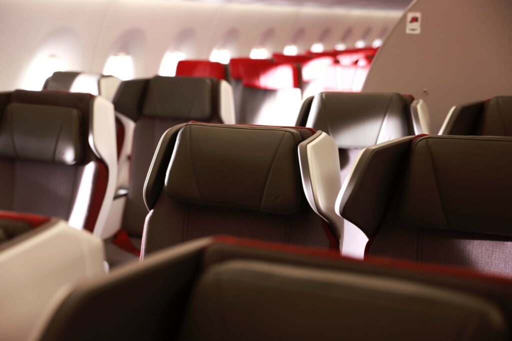 A darker grey is used in premium economy seating and headrests have wings, as shown here in a close-up photo.