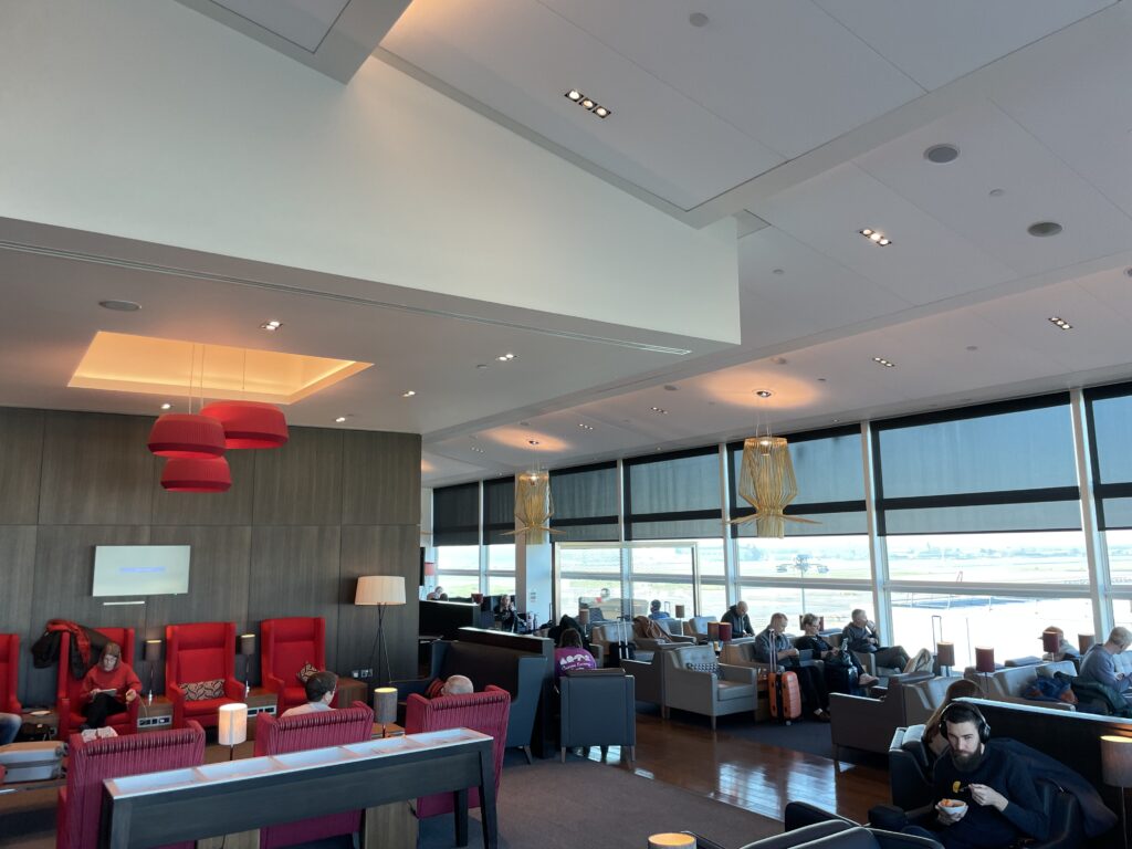 A large open seating area in the BA Club lounge at Gatwick Airport