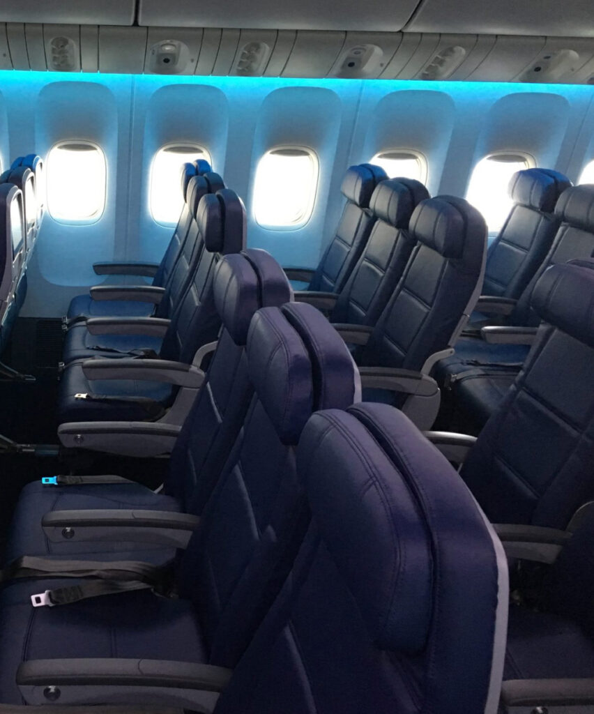 Delta 777 economy class seating in all blue with blue LED lighting. Air India is now using this aircraft