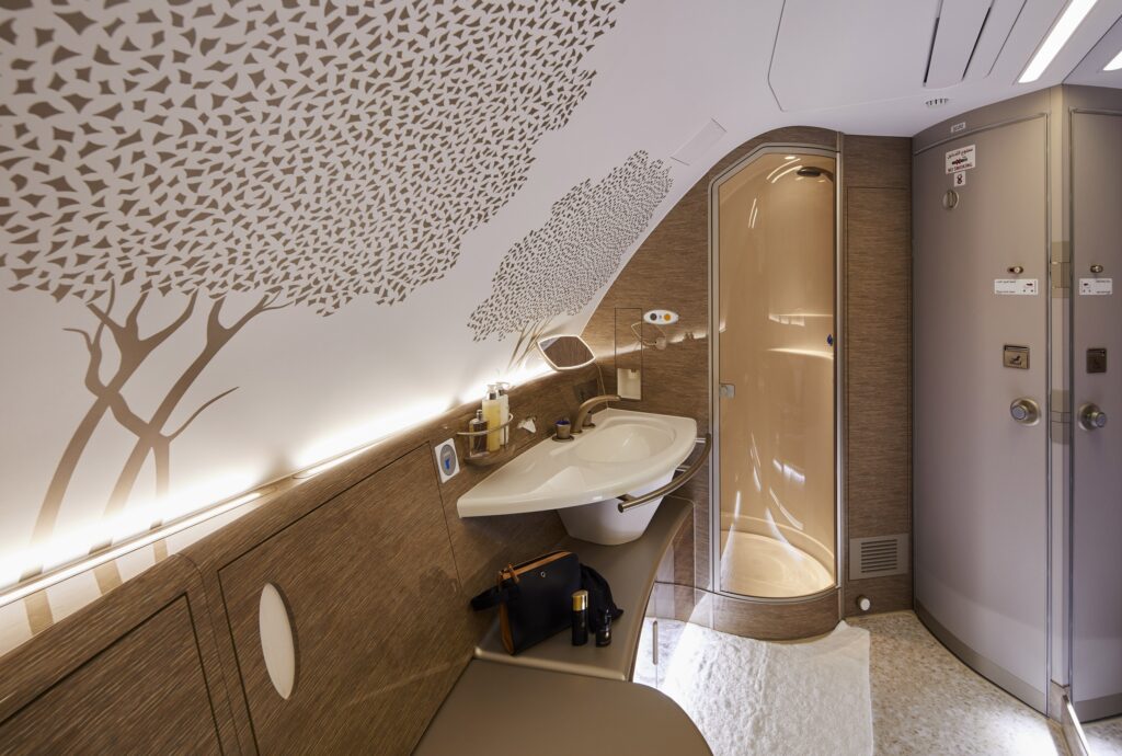 The A380's refreshed shower spa design with tree motif is shown.