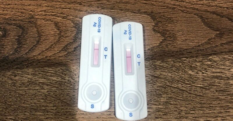 Two negative Covid tests on a table