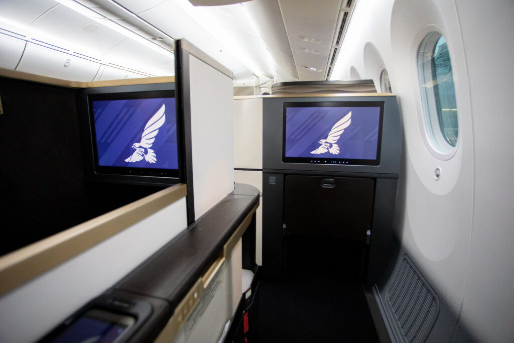 The Gulf Air Business Class seat on the Boeing 787-9 provides serious bed length, at over 6ft. Here, the space in front of the passenger is clearly in view, as well as a large IFE screen.