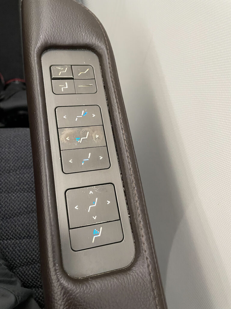 Seat and light control buttons for the business class seat