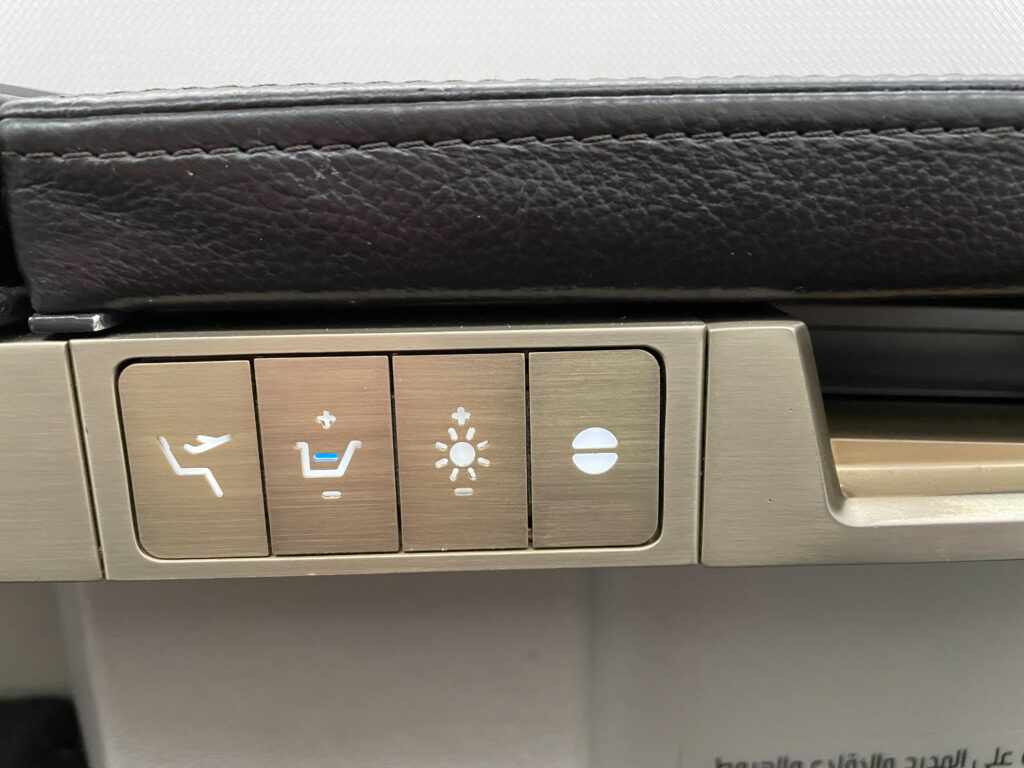 Seat and light control buttons for the business class seat