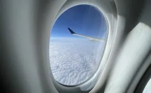 Looking out of the cabin window of a Delta A220 in flight