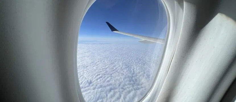 Looking out of the cabin window of a Delta A220 in flight
