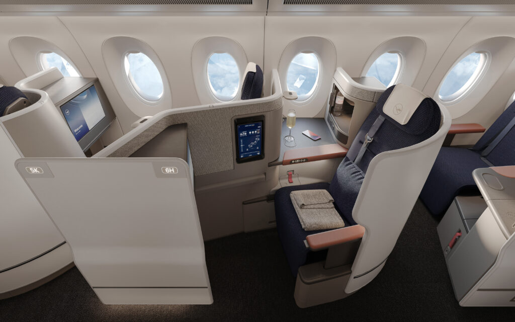 Aisle adjacent seat: Lufthansa Allegris business class seat on display. 