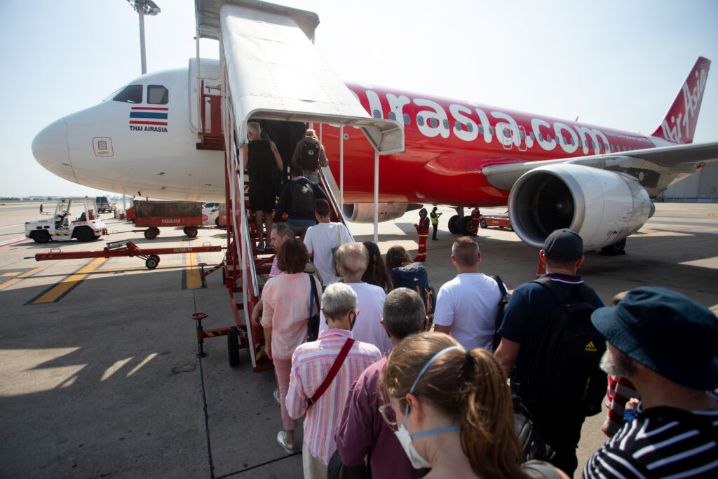 Passengers boarding the Thai AirAsia A320 outside.