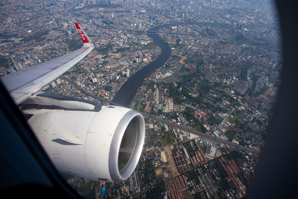 A view of a city from the aircraft window on board Thai AirAsia