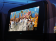 FIFA Women's World Cup winners are celebrating in a video that is being shown on a seatback screen of an aircraft.