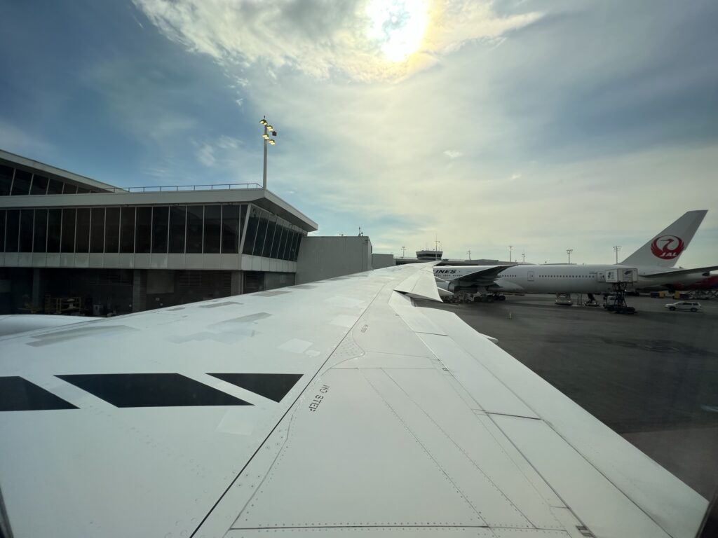 Looking out the aircraft window over the aircraft wing. 