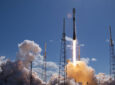 OneWeb 17 LEO satellite launch via SpaceX in Florida. The rocket is mid launch and there is smoke clouds all around it.