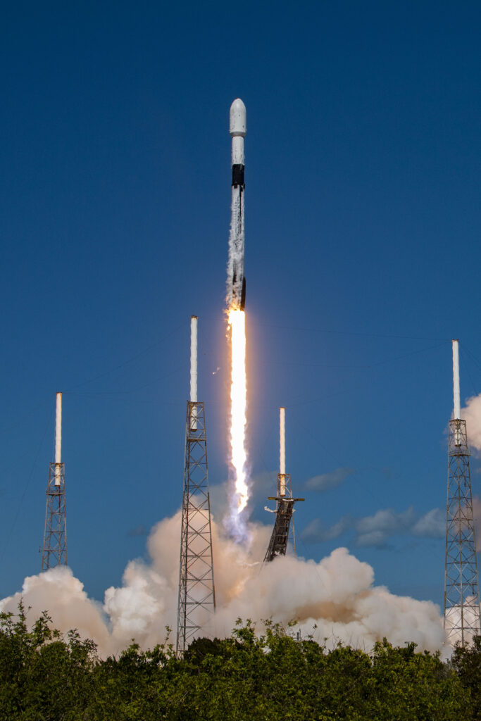 OneWeb 17 LEO satellite launch via SpaceX in Florida. The rocket is mid launch and there is smoke clouds all around it.