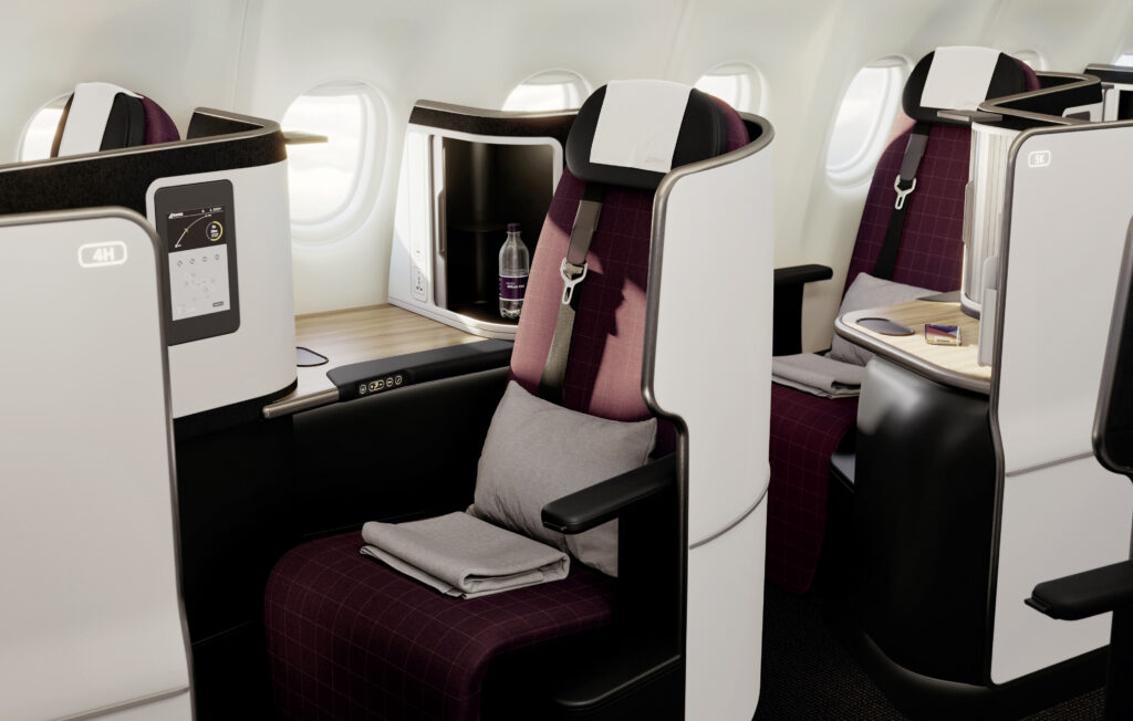 Swiss Senses Business Class seat. A Bordeaux seat with white thermoplastics and grey details.