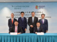 Cathay Pacific Witnessed by SPIC Chairman Qian Zhimin (standing, second from right) and Vice President Chen Haibin (standing, first from right), Cathay Pacific Group Chief Executive Officer Ronald Lam (standing, second from left), and Chief Operations and Service Delivery Officer-designate Alex McGowan (standing, first from left), the MoU was signed by SPIC International Finance (HK) Co. Ltd. Chairman Yin Guoping (seated, right) and Cathay Pacific General Manager Corporate Affairs Andy Wong (seated, left).