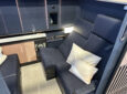 Allegris First Class seat for Lufthansa is navy blue with wood like details.